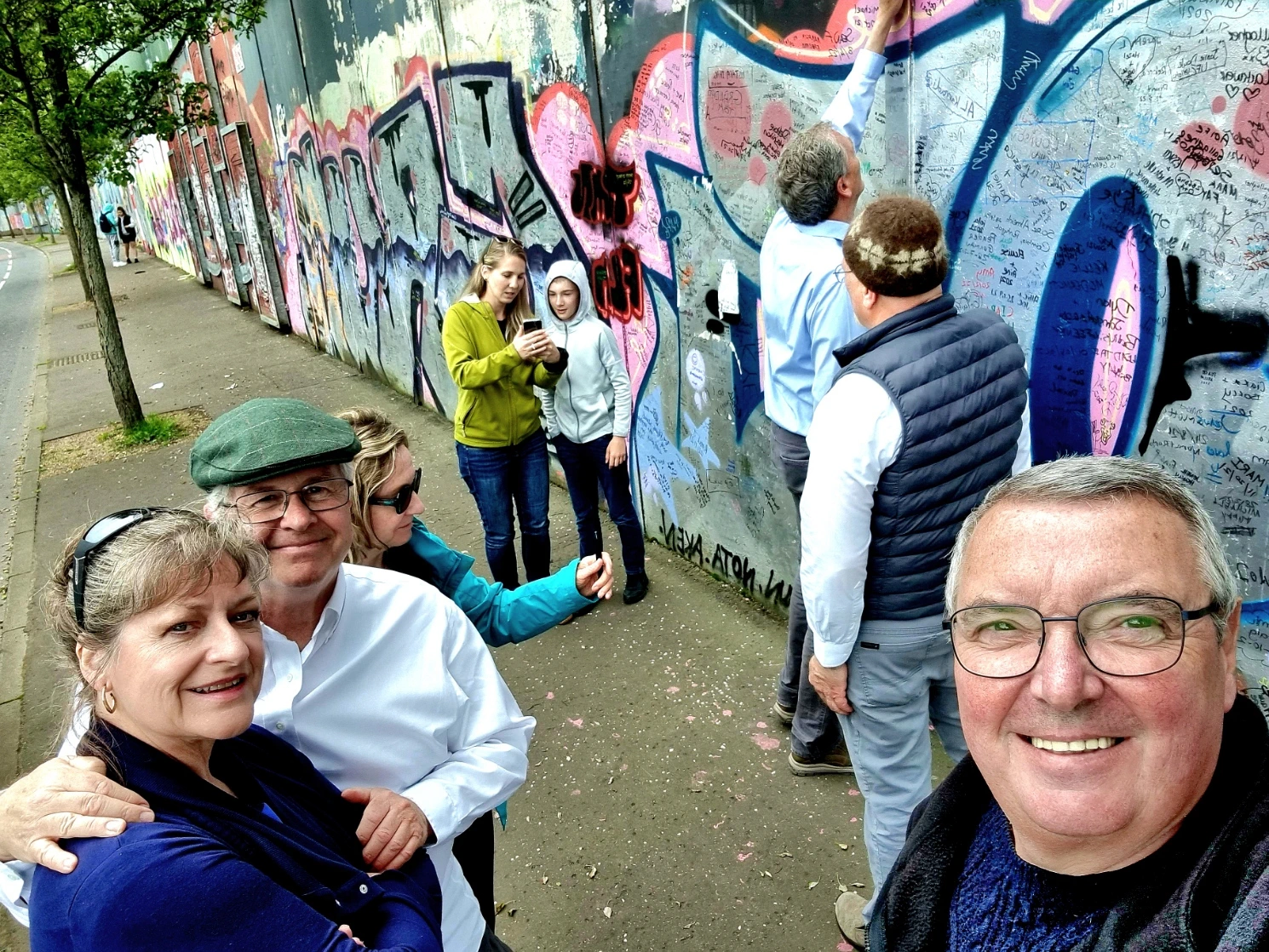 Author Francis Higgins at the Peacewall where his family's House was burned out Author Francis Higgins at the Peacewall where his family's House was burned out