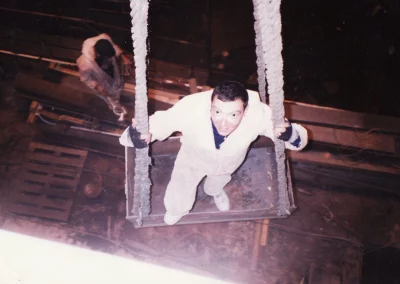 Francis Higgins spray painting the side of the Bulk Carrier Erradale in the mid 1990s